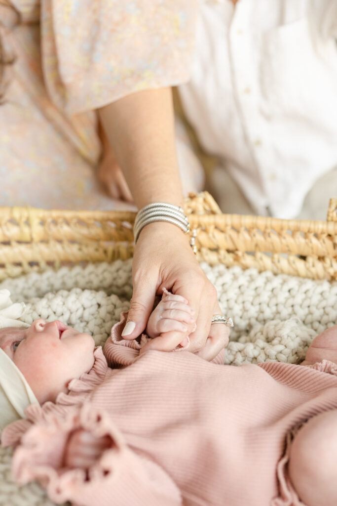newborn hand detail with mom Houston newborn photographer