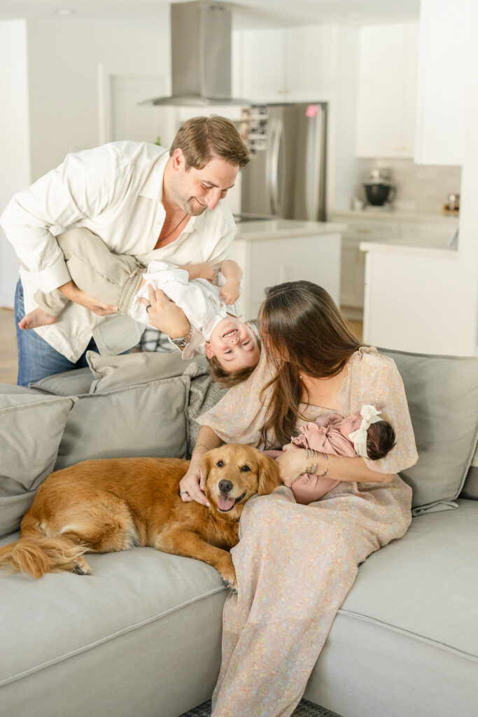 toddler having fun at a newborn session Houston newborn photographer